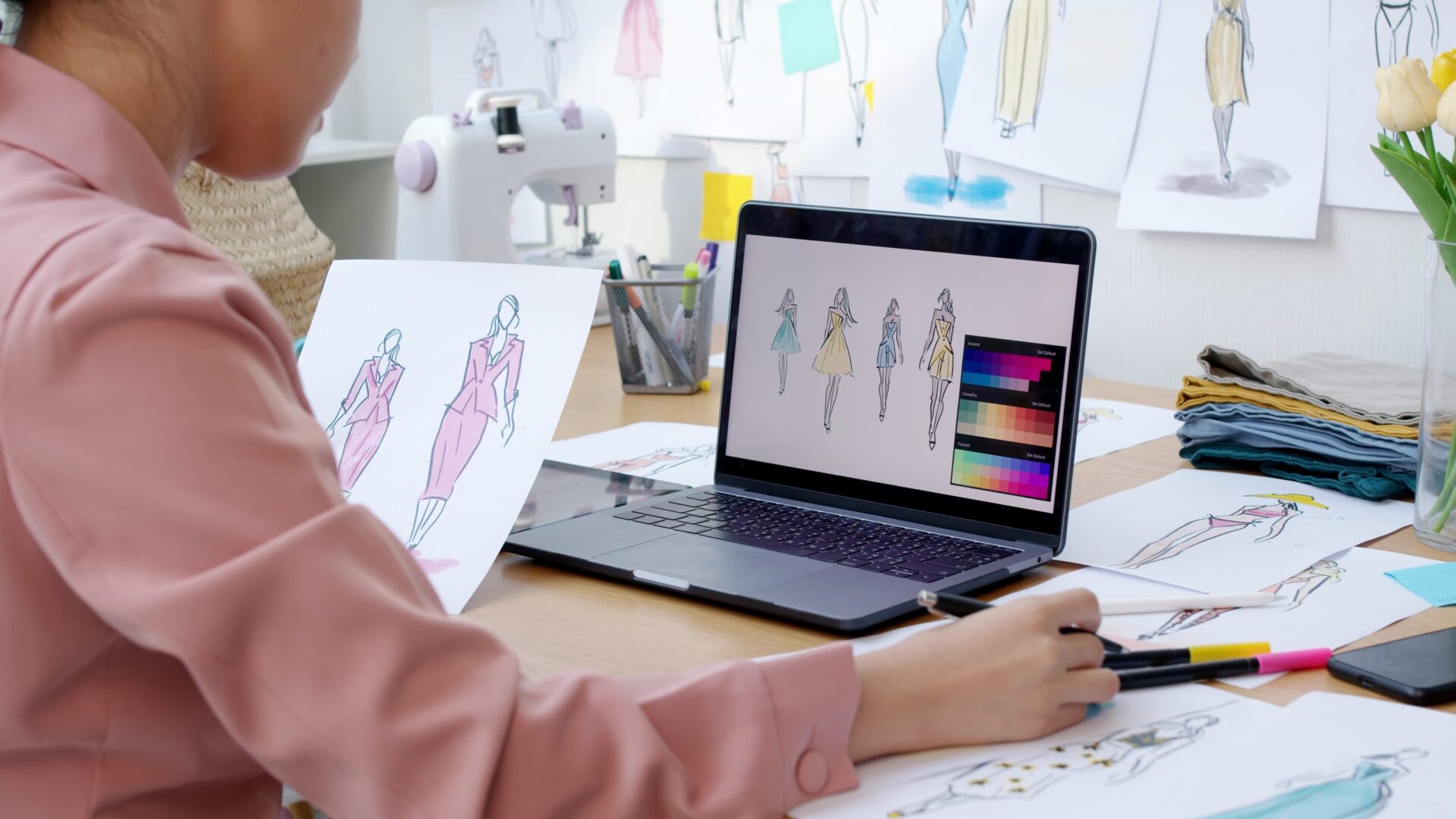 Woman designing clothing on design software