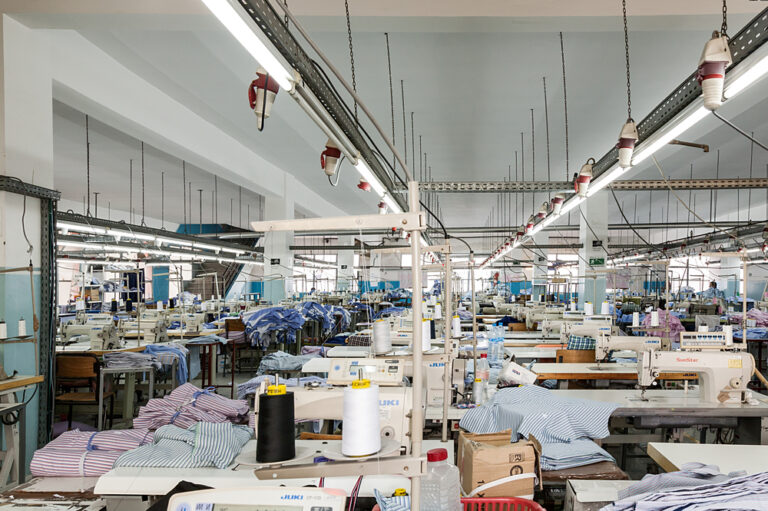 Garment manufacturing sewing floor with industrial machines and production lines representing the type of apparel operation supported by PolyPM ERP and PolyNest pattern design software by Polygon Software for manufacturers evaluating which ERP has the best features for apparel efficiency