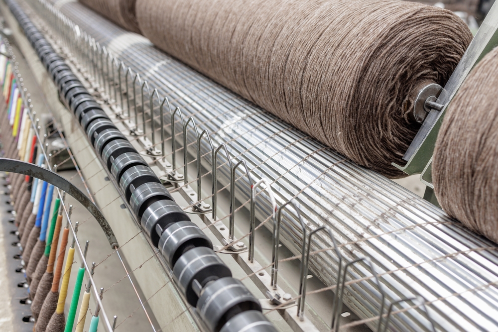 Modern apparel manufacturing environment where apparel supply chain management software helps manage production schedules, inventory, and distribution.
