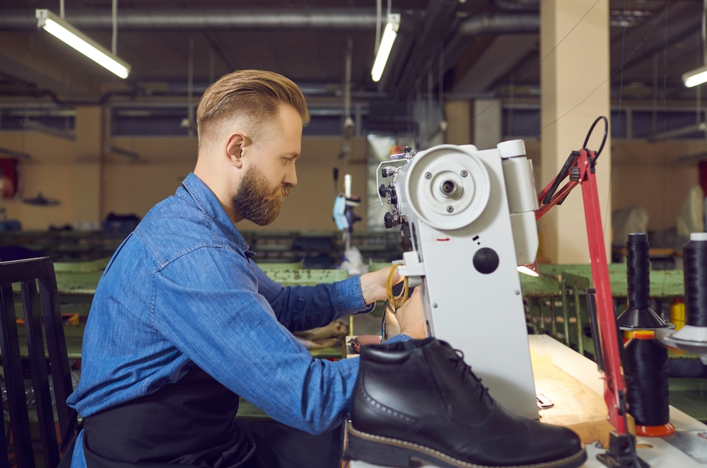 Shoe manufacturing equipment in a modern factory demonstrating best erp for footwear operational excellence through streamlined production management.