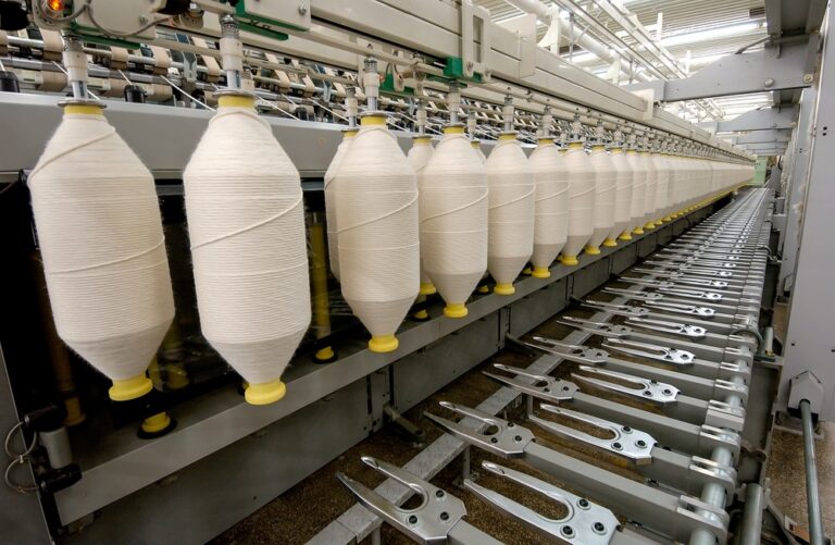 Industrial sewing system that operates with apparel production tracking in a factory