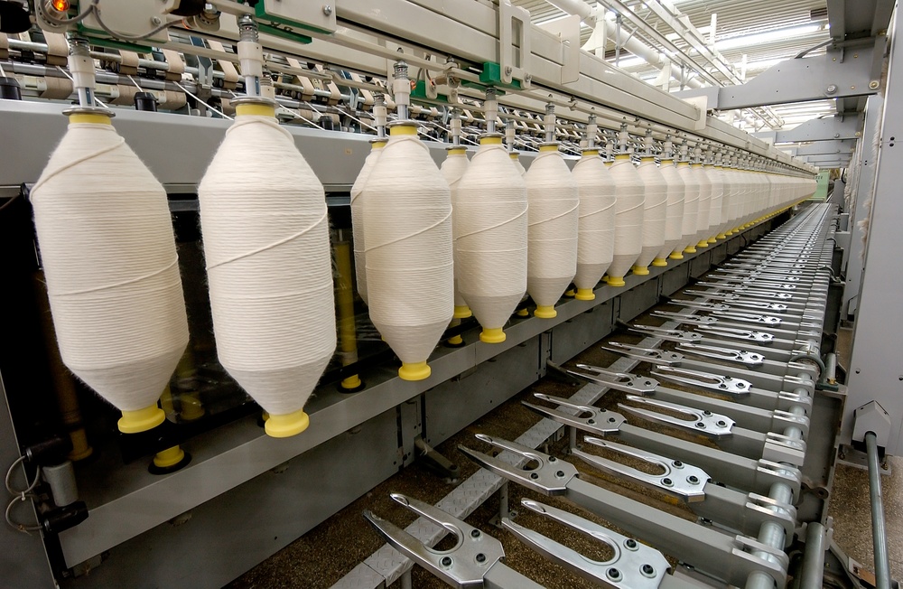 Industrial sewing system that operates with apparel production tracking in a factory