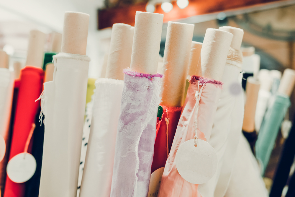 Apparel quality control check on fabric rolls in a garment production facility
