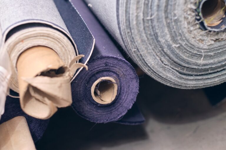 Close-up of a labeled fabric roll used to demonstrate fabric roll tracking software in a garment factory