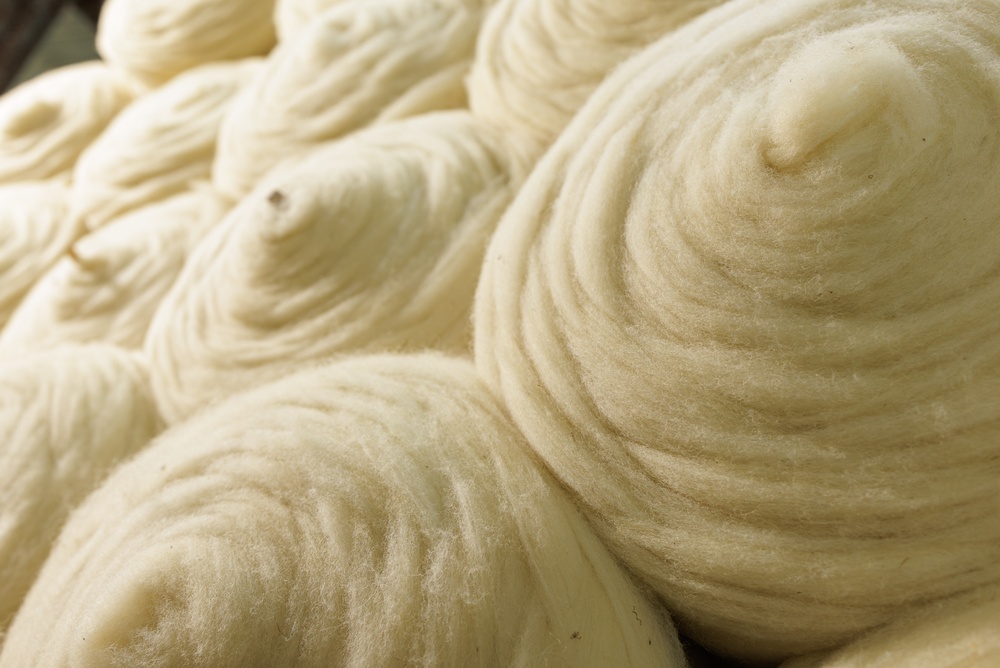 Rolls of yarn being recorded in fabric roll tracking software