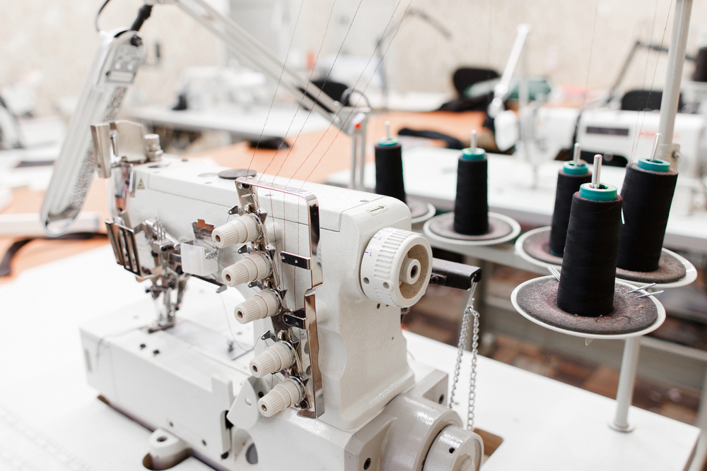 Industrial sewing machine on an apparel production line managed with clothing manufacturing software